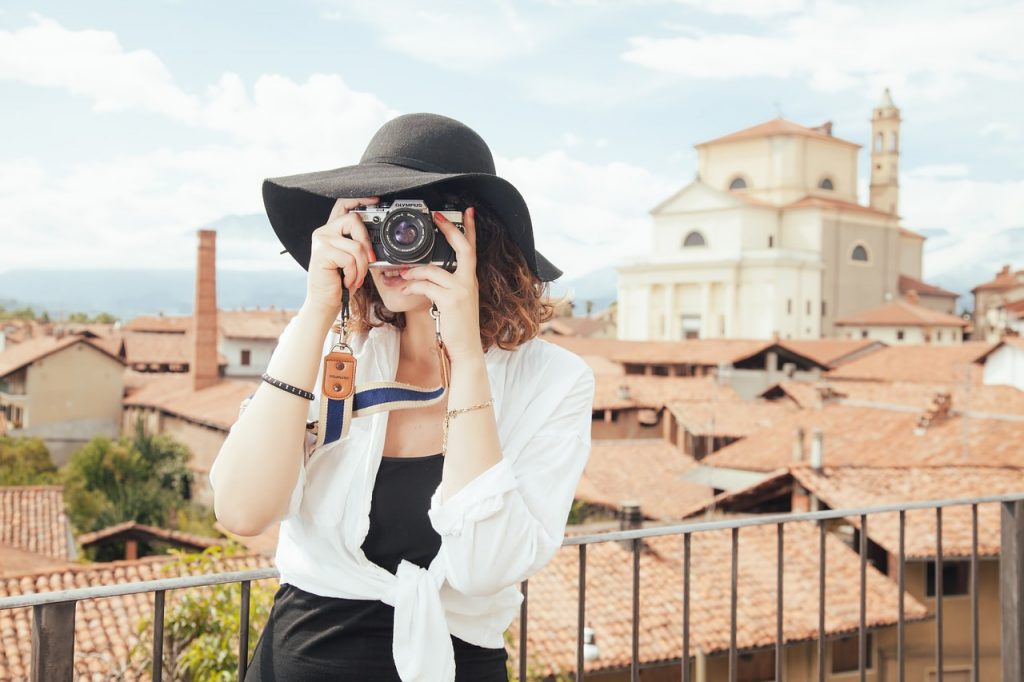 woman traveler holding a camera